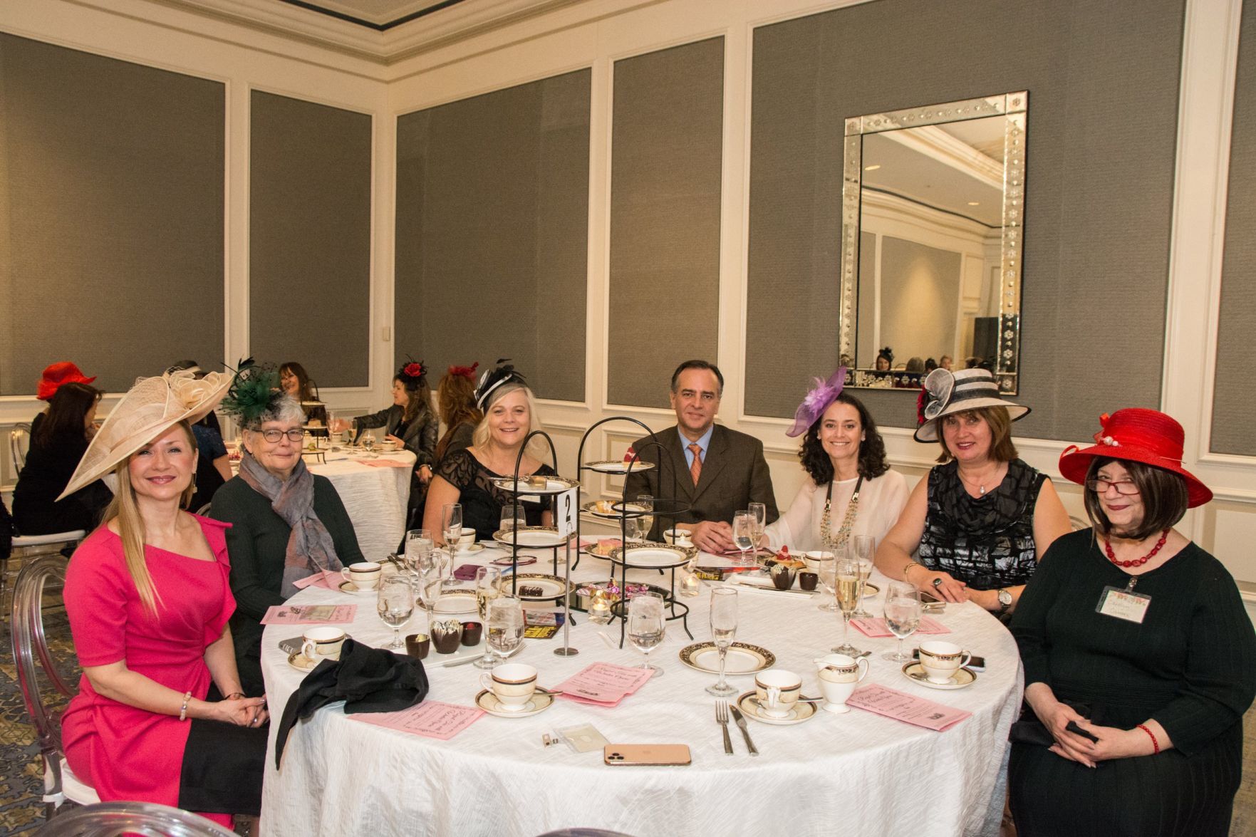A table enjoys high tea at the Ritz during Royal Tea with Winter Opera